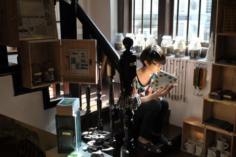 Staff member at 'Books Actually' on Club Street in Singapore. 2010 photograph by Geraldine Kan.